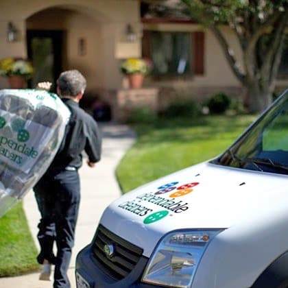 Laundry delivery driver dropping off laundry